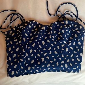 Commense top. Dark blue with white petal pattern. Bow string straps
